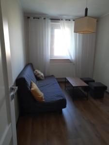 Postel nebo postele na pokoji v ubytování Apartament Janickiego