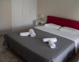Postel nebo postele na pokoji v ubytování Zoe Apartments