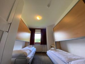 Posteľ alebo postele v izbe v ubytovaní Sonnenburg Hotel