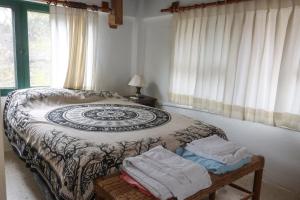 A bed or beds in a room at Galapagos Chalet