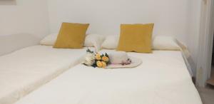 Łóżko lub łóżka w pokoju w obiekcie Apartamento Romero Garden B