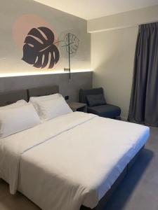 Postel nebo postele na pokoji v ubytování Hotel Lily