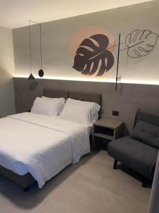 Postel nebo postele na pokoji v ubytování Hotel Lily