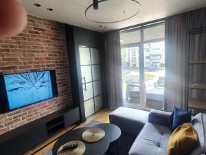 TV a/nebo společenská místnost v ubytování Apartament Szyndzielnia