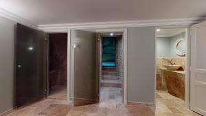a bathroom with a walk in shower and a sink at Château de Valette in La Bachellerie +50 photos