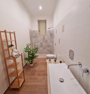 a bathroom with a sink and a toilet in it at A un Passo dal Tramonto in Marsala