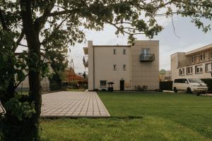 a brick walkway in front of a building at FAMILKA in Karwia