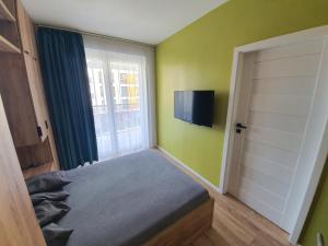 TV a/nebo společenská místnost v ubytování Apartament 24