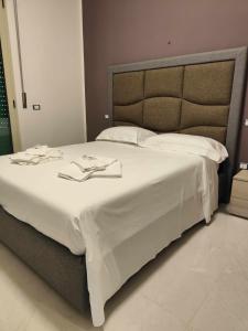 A bed or beds in a room at Fantasia B&B APARTAMENT STUDIO