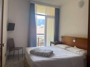 Postel nebo postele na pokoji v ubytování Hotel Gardesana