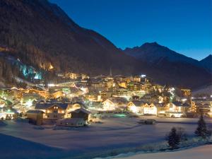 a small town in the mountains at night at Hotel Garni Angelika in Ischgl