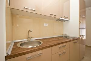 a bathroom counter with a sink and a mirror at IgMAN apartments Tivat in Tivat +52 photos