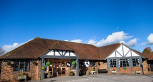 a brick building with a brown roof at Buffalo Bill's in Halland