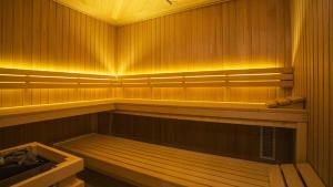 a sauna with wooden panels and avisorternessternessternessstrationstrationpectspects at Villa a cappella in Binz