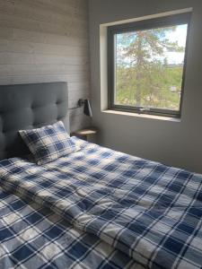 En eller flere senger på et rom på Brand new mountain cabin
