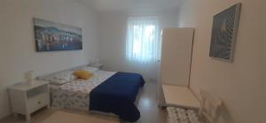 Ein Bett oder Betten in einem Zimmer der Unterkunft Holiday Home Casa Bianca