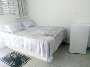 Ένα ή περισσότερα κρεβάτια σε δωμάτιο στο Hotel Picadão