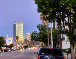 a car parked on the side of a city street at DAY N NIGHT INN - Near Universal Studios Hollywood in Los Angeles