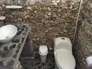 a bathroom with a toilet and a sink at Cabaña sostenible Isla Fuerte in Isla Fuerte +50 photos