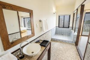 a bathroom with a sink and a shower at Olle Resort & SPA in Jeju