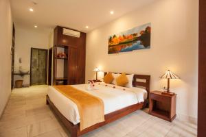 Voodi või voodid majutusasutuse Hoi An TNT Villa toas