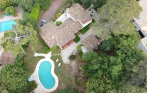 an aerial view of a house with a swimming pool at Cozy Home In Roquefort-Les-Pins in Roquefort-les-Pins +18 photos