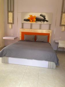 Postel nebo postele na pokoji v ubytování Villa Agung Beach Inn
