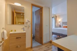 Postel nebo postele na pokoji v ubytování Tagle Hotel Boutique