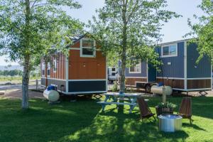 a group of tiny houses in a yard at Teton Peaks Resort in Tetonia