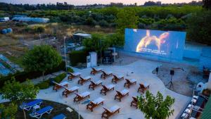 an overhead view of a stage with chairs and a large screen at Fitosinn Hotel in Paphos