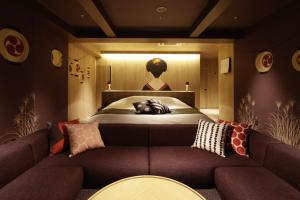Кровать или кровати в номере Yatomi Hotel Nuqu Natural Hot Spring