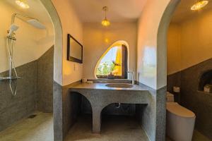 a bathroom with a sink and a window at Flow House 3BR Beachfront An Bang Beach Hoi An by Beachside Boutique Homes in An Bàn (2) +48 photos