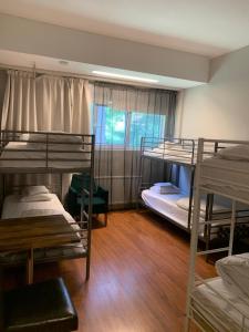 Postel nebo postele na pokoji v ubytování Arkadia Hotel & Hostel