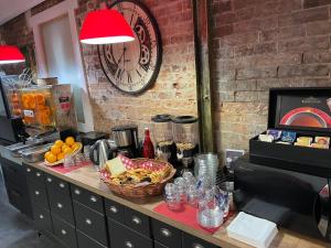 a counter with a basket of food on top at Ménil Bon Temps in Paris