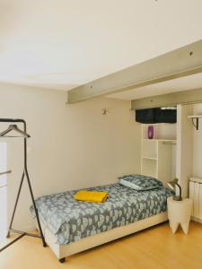 Postel nebo postele na pokoji v ubytování Bordeaux centre historique: Charmant Duplex