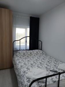 Postel nebo postele na pokoji v ubytování Vila de pe Lac Amara