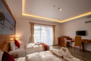 A bed or beds in a room at Manigram Bishram Batika Pvt Ltd