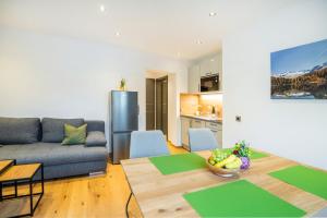 a living room with a couch and a table at Landhaus Rosner in Dorfgastein