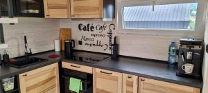 a kitchen with a sink and a counter top at Level780 in Koszarawa
