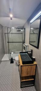 a bathroom with a black sink and a toilet at Level780 in Koszarawa
