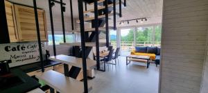 a dining room with a table and chairs in a room at Level780 in Koszarawa