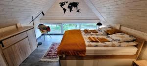 a bedroom with a large bed in a house at Level780 in Koszarawa