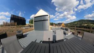 a large deck with a building on top of it at Level780 in Koszarawa