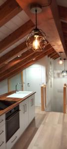 a kitchen with a sink and a stove top oven at casa dositeo in Sarria