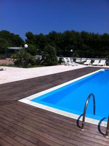 Bazén v ubytování Camping Cala dei Ginepri nebo v jeho okolí