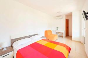 Postel nebo postele na pokoji v ubytování Camping Cala dei Ginepri + 36 fotografií