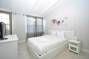Posteľ alebo postele v izbe v ubytovaní South Beach Apartments