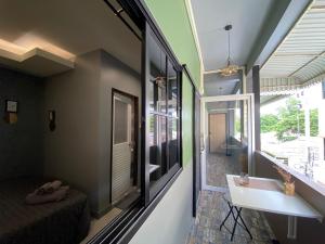 a room with a bathroom with a sink and a mirror at VarietyD-DayHostel HuaHin in Hua Hin