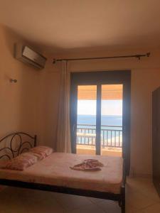 Ένα ή περισσότερα κρεβάτια σε δωμάτιο στο Bella Vista Apartments