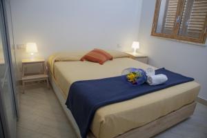 Postel nebo postele na pokoji v ubytování Case Vacanze Baia